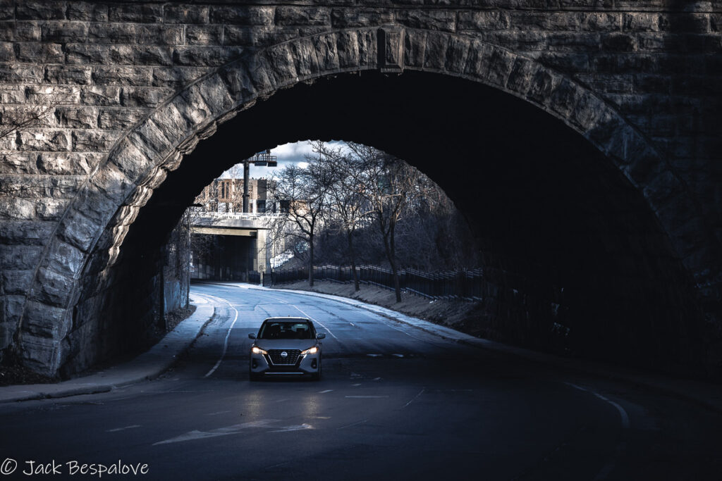 Car under dark bridge